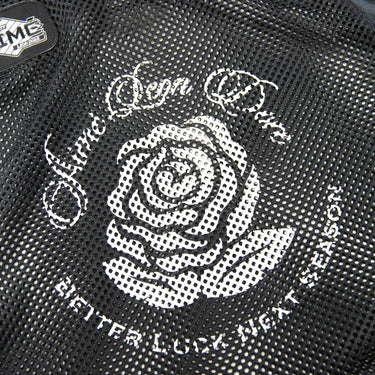 The logo of the Aime Leon Dore Stadium Cropped Practice Black Jersey.