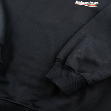 The sleeve of the Balenciaga Campaign Logo Black Sweatshirt.