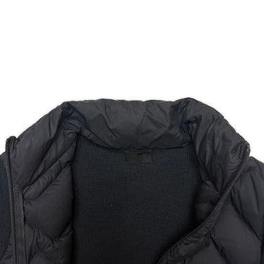 The inside label of the Moncler Quilted Shell Ribbed Knit Cardigan Jacket.
