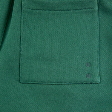 The pocket of the about:blank Green Shorts.