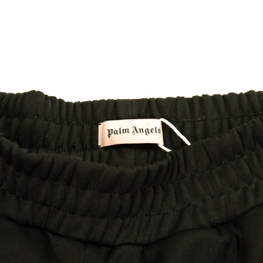 The inside label of the Palm Angels Rainbow Black Sweatpants.