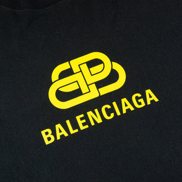 The logo of the Balenciaga Yellow BB Logo Black T Shirt.