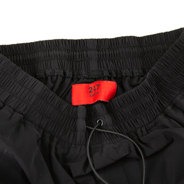 The label of the Represent Black Cargo Trousers.