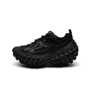 The left of the Balenciaga All Black Bouncer Sneaker.