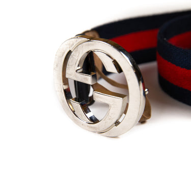 Shows the Gucci belt buckle and logo on the Navy & Red Stripe GG Belt in multicolour.