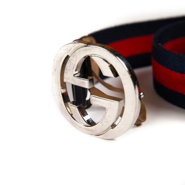 Shows the Gucci belt buckle and logo on the Navy & Red Stripe GG Belt in multicolour.