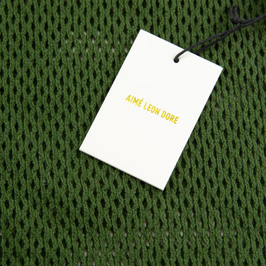 The tag of the Aime Leon Dore Mesh Knit Tank Top.