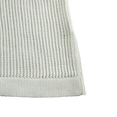 The detail of the Aime Leon Dore Mesh Knit Cream Polo M.