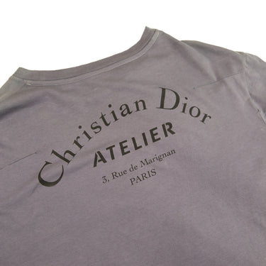 The back logo of the Dior Atelier Purple Dyed T-Shirt .