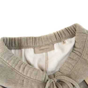 The waistband of the Fear Of God ESSENTIALS Dark Oatmeal Sweatpants.