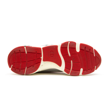 The sole of the Dior Dior B22 Grey Red Blue Trainer.