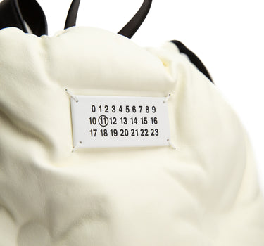 The logo of the Maison Margiela Glam Slam Drawstring Backpack.
