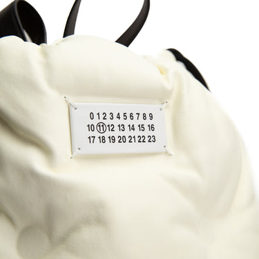 The logo of the Maison Margiela Glam Slam Drawstring Backpack.
