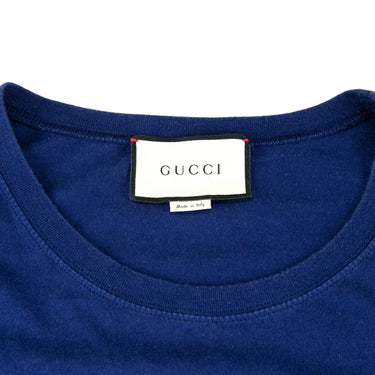 The label of the Gucci  ear Navy T Shirt.