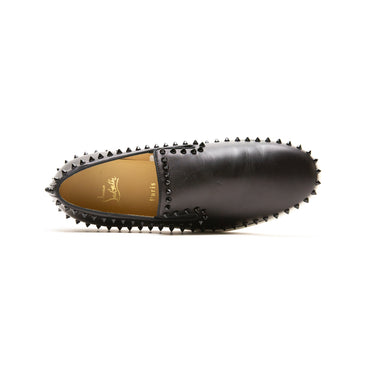 The top of the Christian Louboutin Black Spike Boat Shoes.