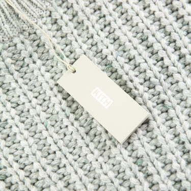 The tags of the Kith Lyon Grey Knit Sweater.