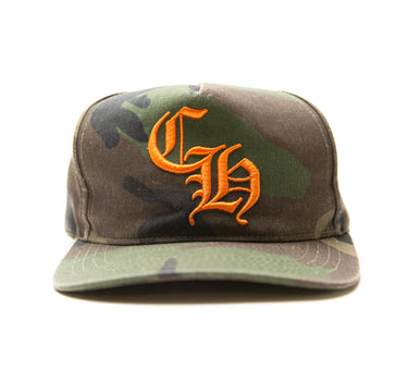 The front of the Chrome Hearts CH Camo Trucker Hat.