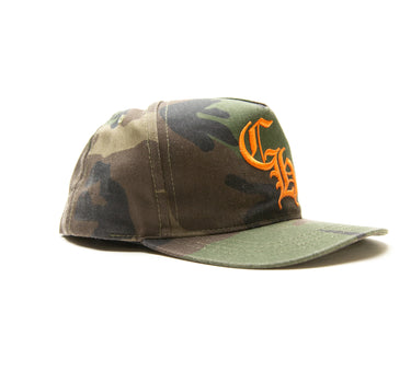 The side of the Chrome Hearts CH Camo Trucker Hat.