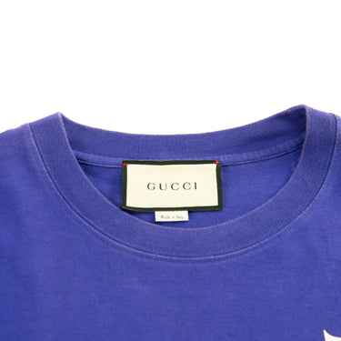 The collar and inside label of the Gucci Blue Spellout T Shirt.