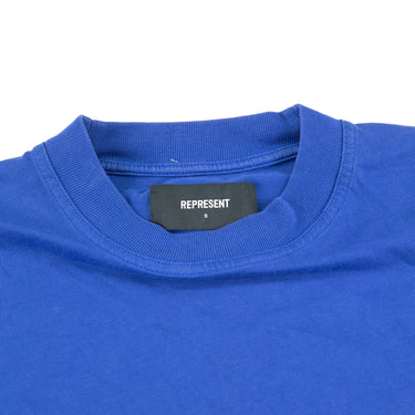 The collar of the Represent Owners Club Blue T Shirt.