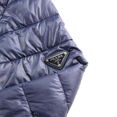 The logo of the Prada Milano Navy Puffer Jacket.