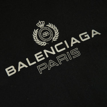 The front logo of the Balenciaga Paris Black T Shirt.