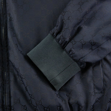 The sleeve of the Gucci Navy Monogram Jacket.