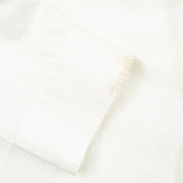 A close up of a part of the Burberry white button-up shirt.