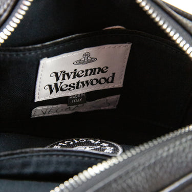 Inside view showing the label of a Vivienne Westwood Patent Leather Crossbody Bag in black.