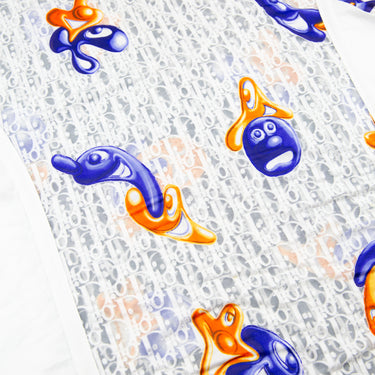 The print of the Dior x Kenny Scharf Oblique Mesh T Shirt.