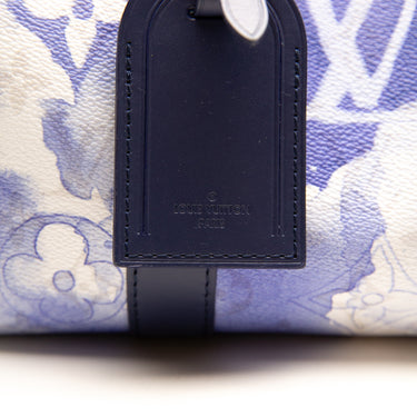 The tag of the Louis Vuitton City Keepall Monogram Watercolour Bag.