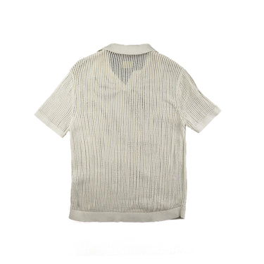 The back of the Aime Leon Dore Mesh Knit Cream Polo M.