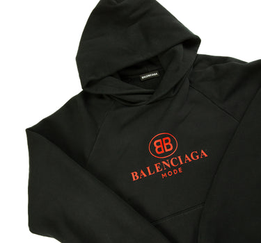 The hood and logo of the Balenciaga Mode Red & Black Hoodie.
