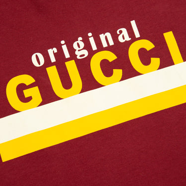 The front logo of the Gucci Original Gucci Burgundy T Shirt.