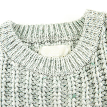 The collar of the Kith Lyon Grey Knit Sweater.