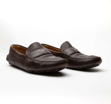 The front view of Prada Brown Pebbled Loafers.