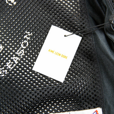 The tags of the Aime Leon Dore Stadium Cropped Practice Black Jersey.