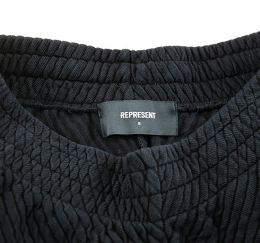 The label of the Represent Black Ottoman Shorts.