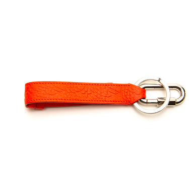 The side of the Louis Vuitton Red Harness Dragonne Bag Charm.
