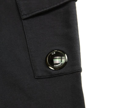 The logo of the C.P. Company Navy Lens Sweatpants.