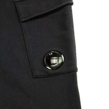 The logo of the C.P. Company Navy Lens Sweatpants.