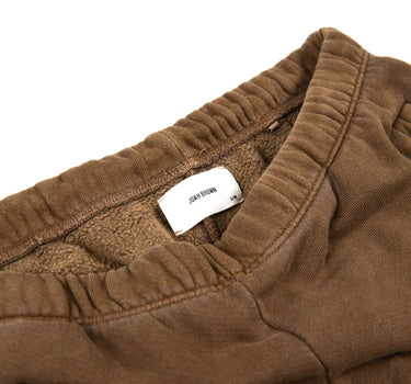 Inside view showing the label and band of Joah Brown sweatpants, in brown.