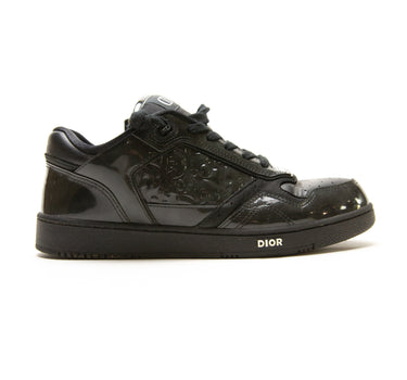 The side of the Dior B27 Low Black Patent Dior Oblique Trainers.