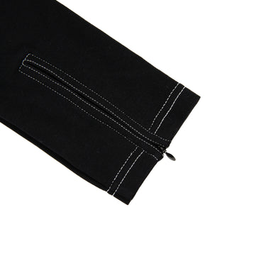 The sleeve detail of the Burberry Black Dress with White Stitching.