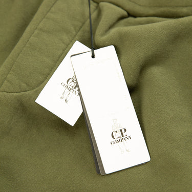 The tags of the C.P. Company Diagonal Fleece Mixed Lens Khaki Sweatpants.
