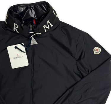 The logo of the Moncler Beid Navy Jacket.