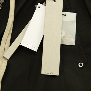 The tags of the Rick Owens Bela Bermuda Shorts.