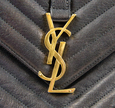Shows the logo of a Yves St Laurent Large College Black Leather Bag.