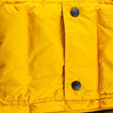 The buttons of the Moncler Down Yellow Gilet.