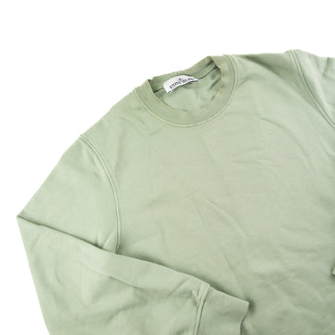 The flat lay of the Stone Island Sage Crew Neck Sweater.
